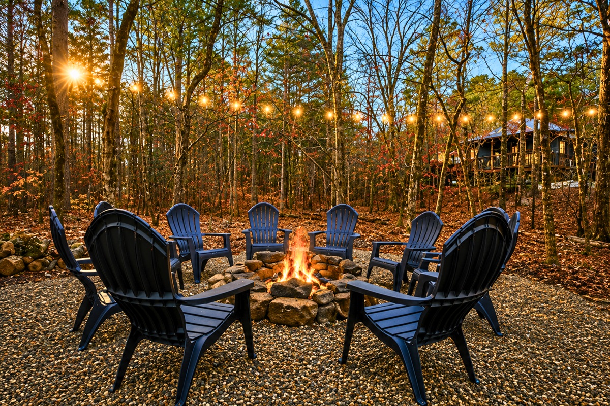 Surrounded by the woods, the fire pit area invites everyone to gather together for late-night stories and s&rsquo;mores under the stars.