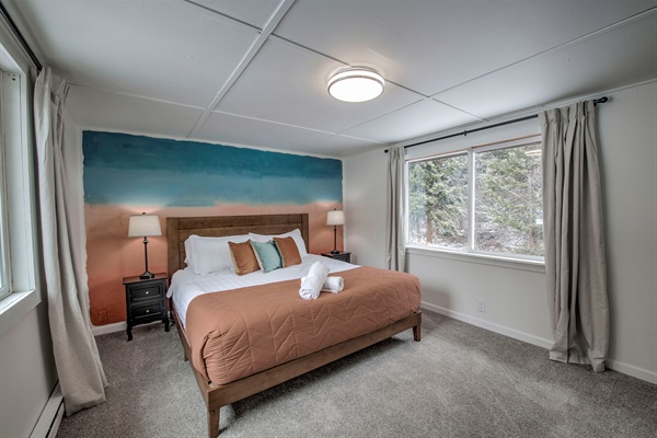 Recharge in your serene bedroom—plush bedding, soft light, and peaceful views create a calming retreat that’s all yours. Just outside the window, you will hear Spruce Creek running from April to November; the incredibly beautiful sounds lull you to sleep. 