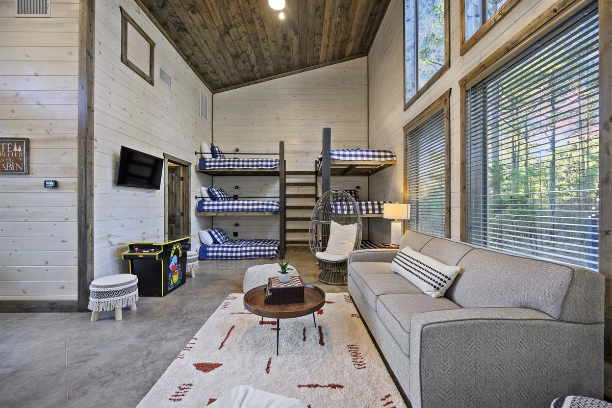 The bunkhouse is a favorite hangout spot with games, cozy seating, and plenty of space for kids and teens to unwind after a day of adventure.