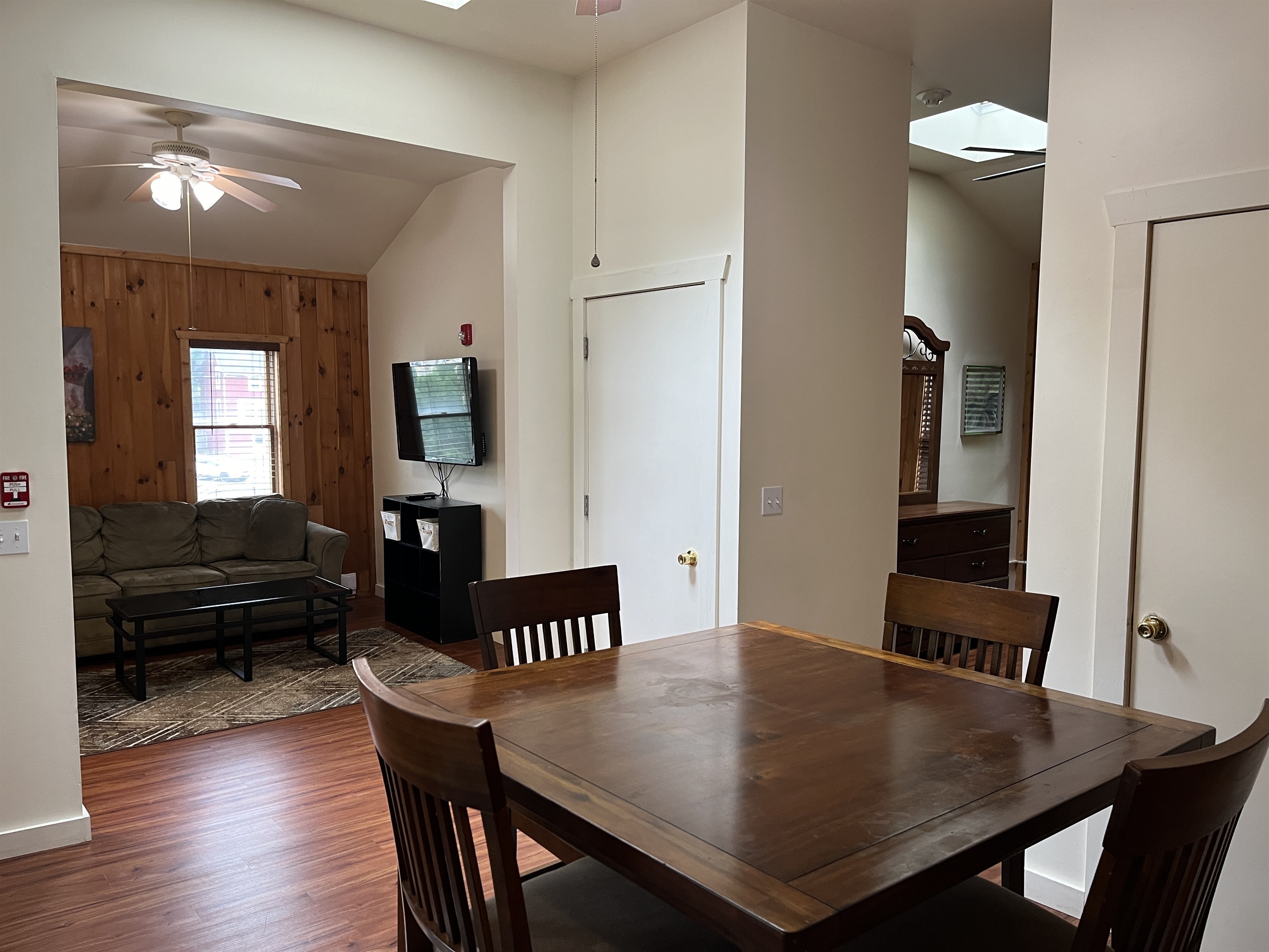 Dining area with living room and office beyond
