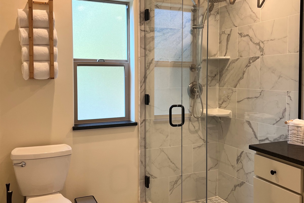 Hot showers on cool mornings in your private hotel-style bathroom.  This shower has both rainfall and handheld shower heads.