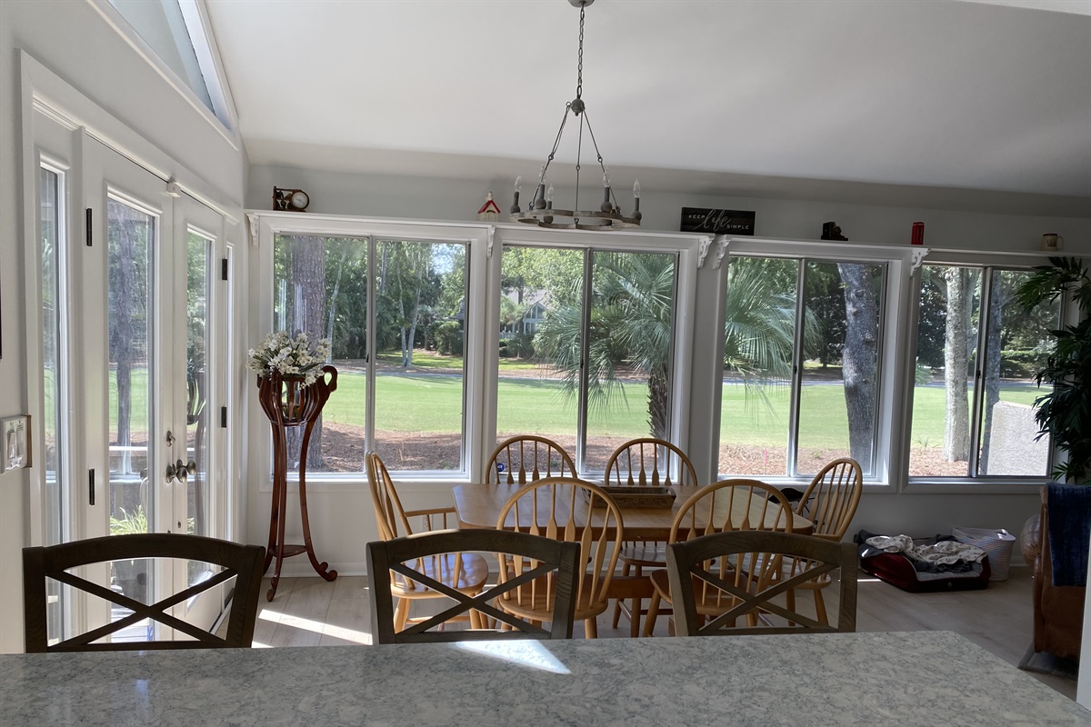 View from kitchen to dining room and 2nd fairway