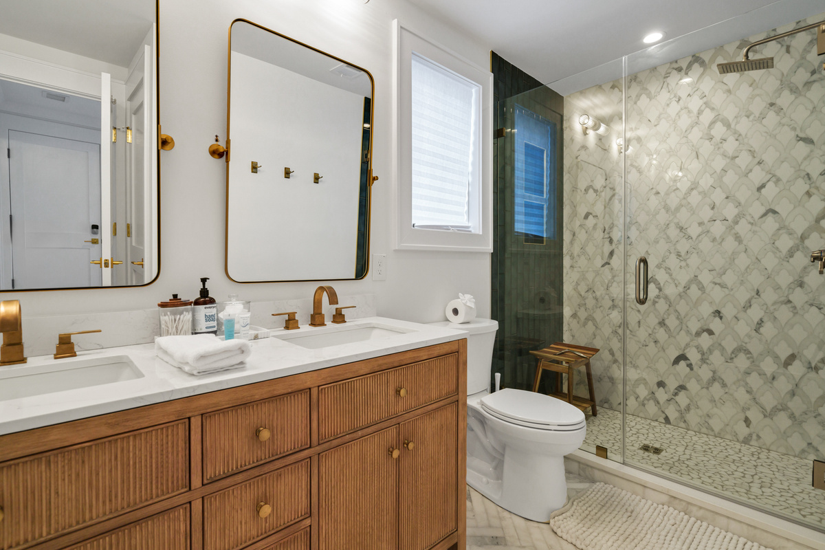 Guest Bath 3 in Hallway on 1st Living Level.  Tiled Floor and Walk In Shower, Double Vanities!