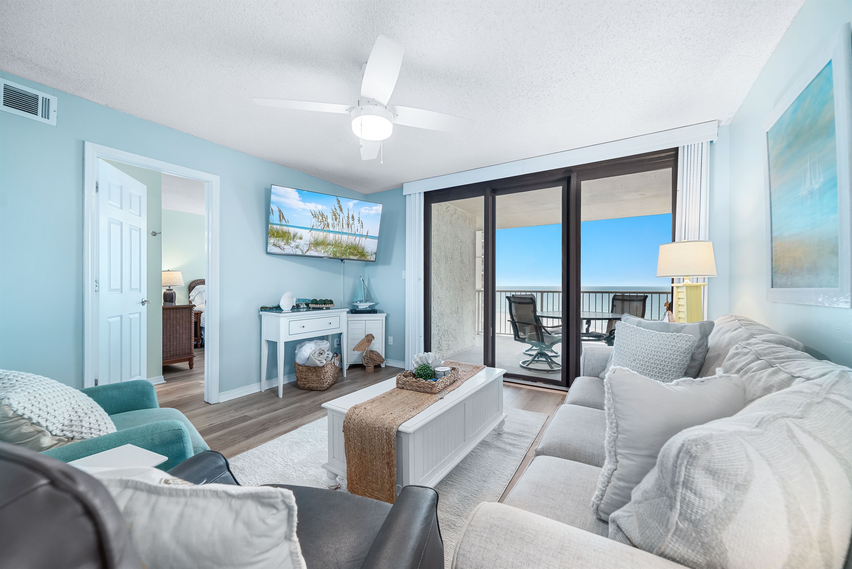 The seamless transition to the outdoor balcony enhances the sense of light and openness.