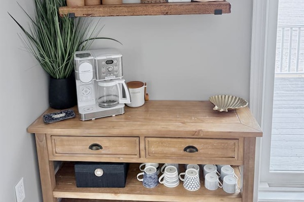 Start your mornings right at this charming coffee bar. It is the perfect, cozy spot for friends and family to gather, brew a fresh cup, and relax together during your dream coastal vacation.