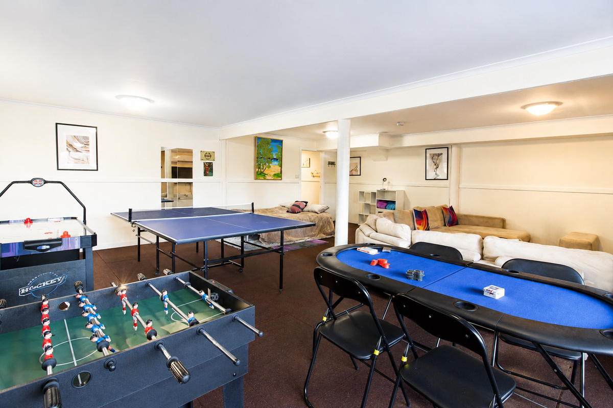 The games lounge at Carlenes Getaway gives your Loch Sport stay an easy all-weather space with table games, seating and room to relax.
