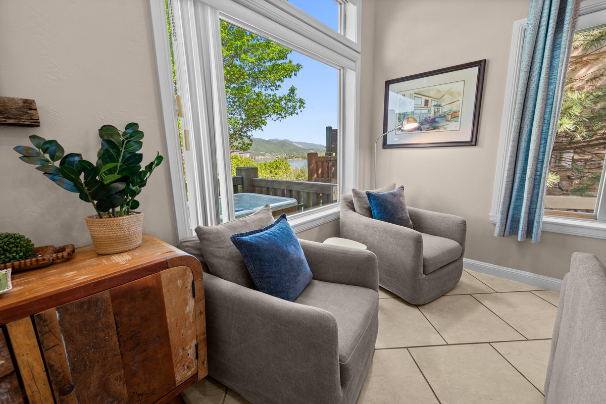 A cozy sitting area with two plush chairs perfectly positioned to relax, unwind, and take in beautiful views of Pineview Reservoir and the surrounding mountains.