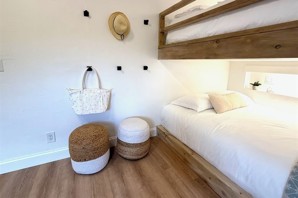 Each bed has its own cozy space with a lit nook and shelf to charge electronics