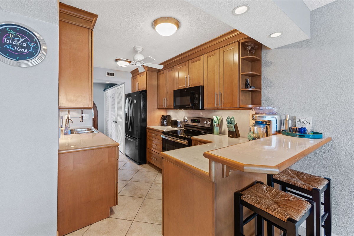 A fully equipped kitchen with modern appliances, ready for family meals or romantic dinners.