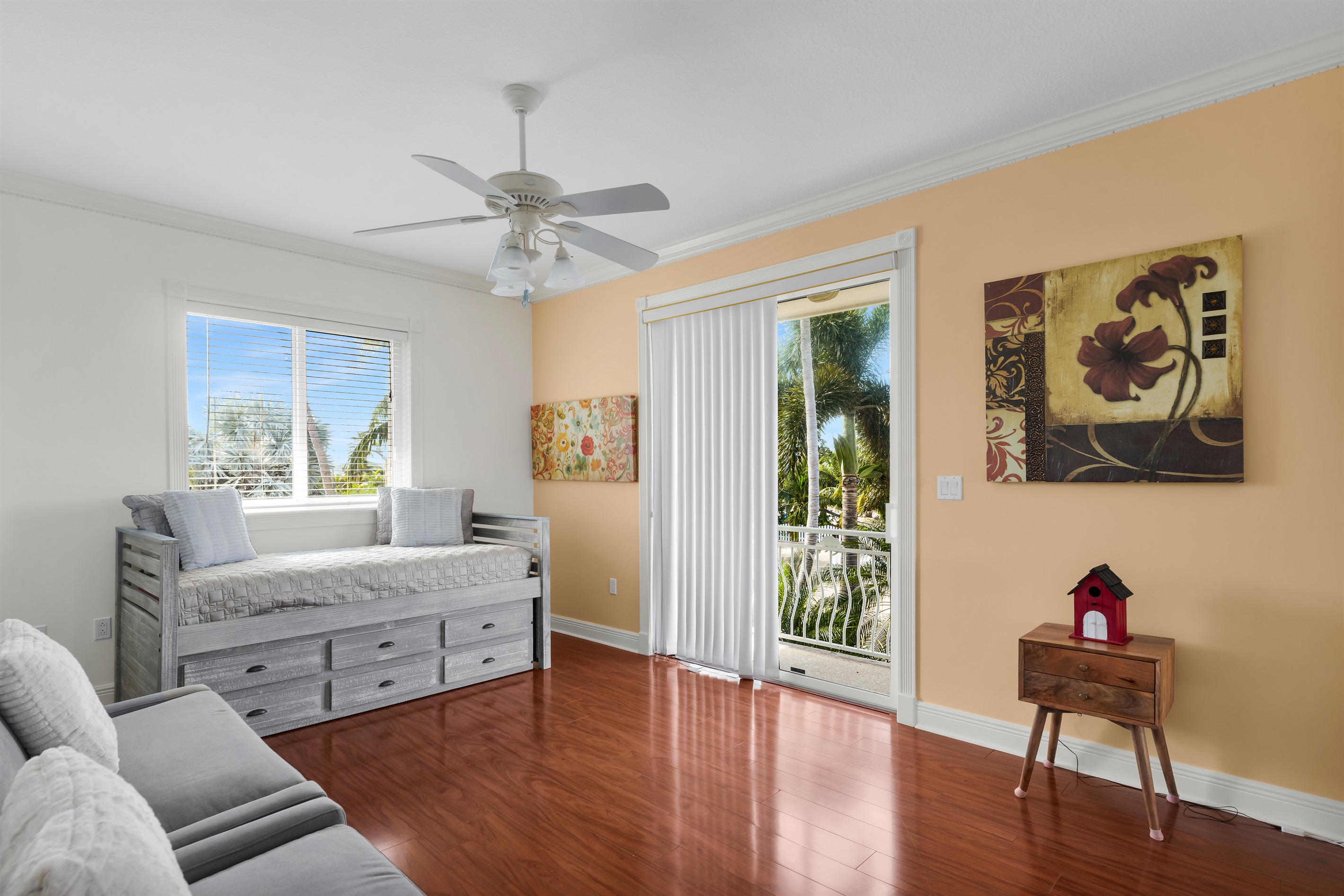 Guest bedroom featuring a twin with trundle and two oversized chair sleepers