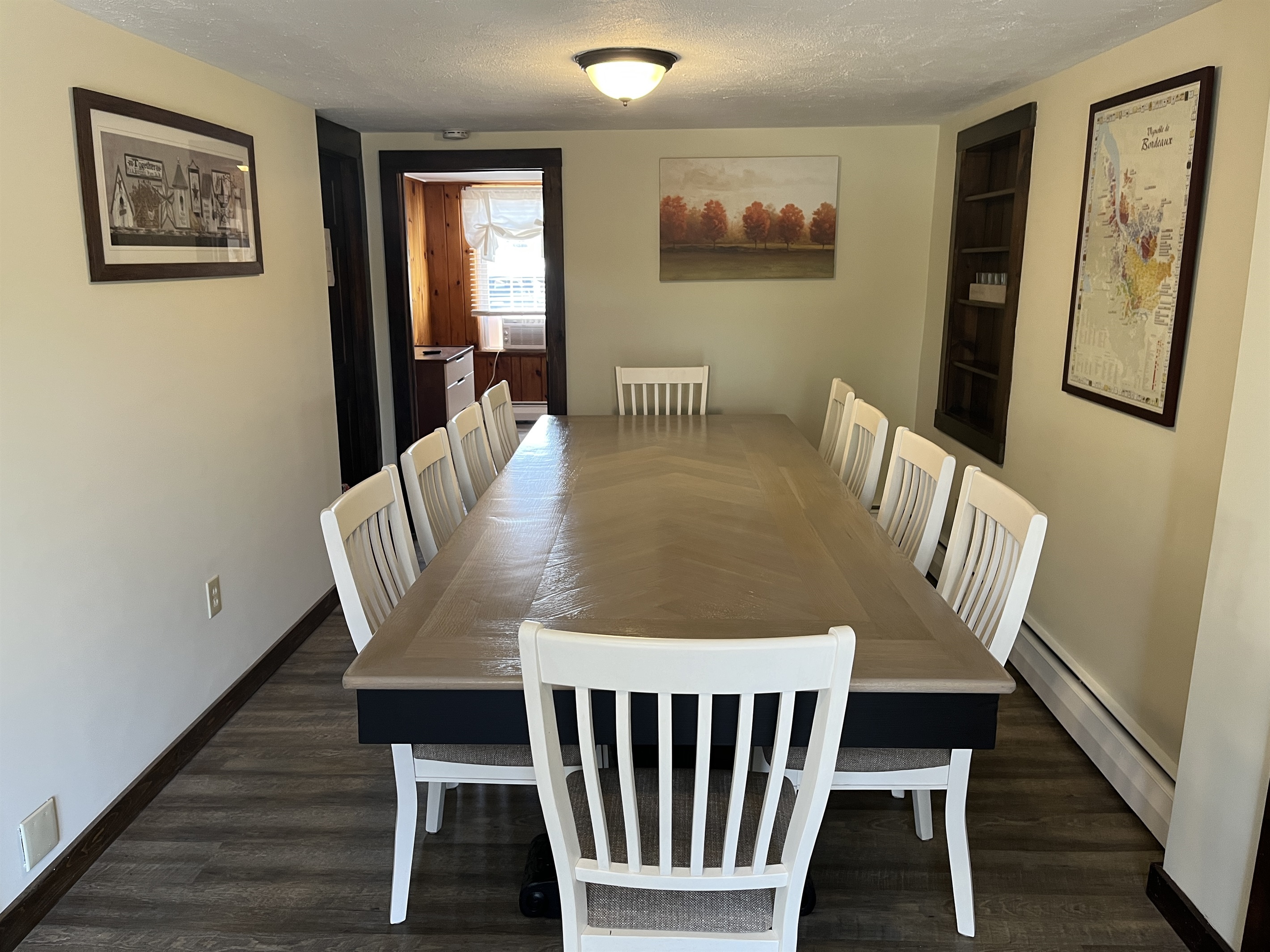 Roundtripper formal dining room with a custom built farmhouse table for 10 people.