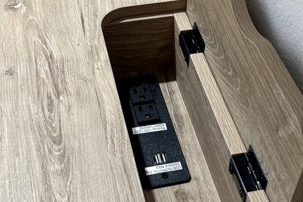 Nightstand and desk have USB charging stations and outlets 