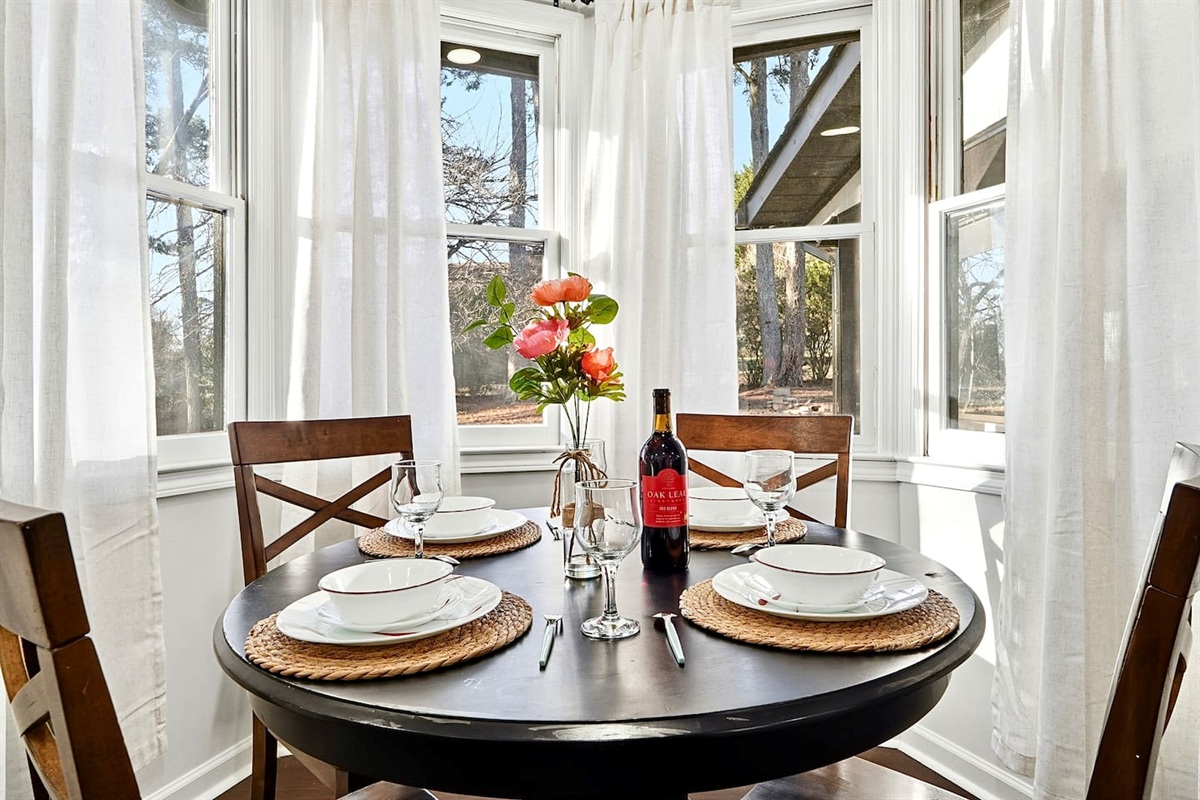 Charming kitchen-side breakfast nook with seating for four. A cozy spot for coffee, breakfast, or casual conversations with family and friends.