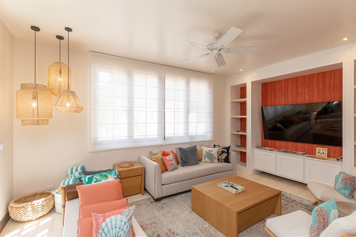 Located in the right wing beside the kitchen, the large living room directly off the pool area is perfect for relaxing after a day at the beach.