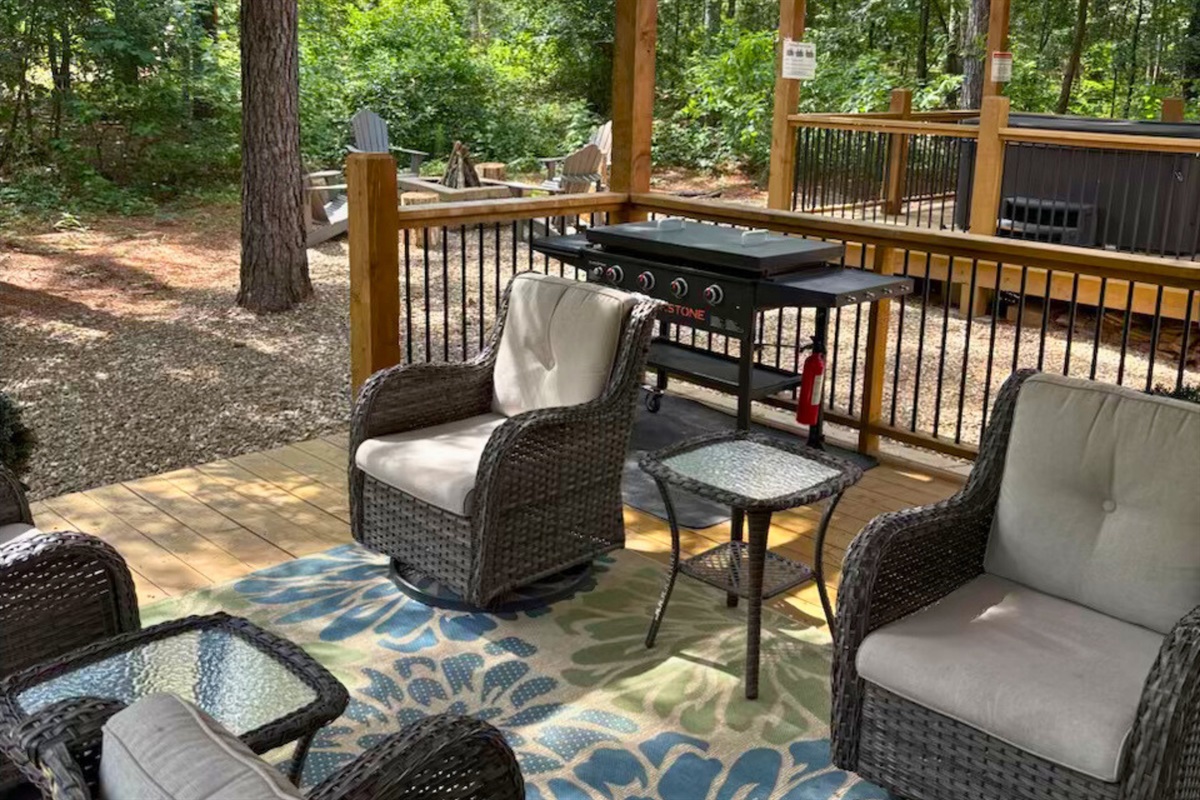 Relax and unwind on the deck with cozy seating and a perfect grill setup