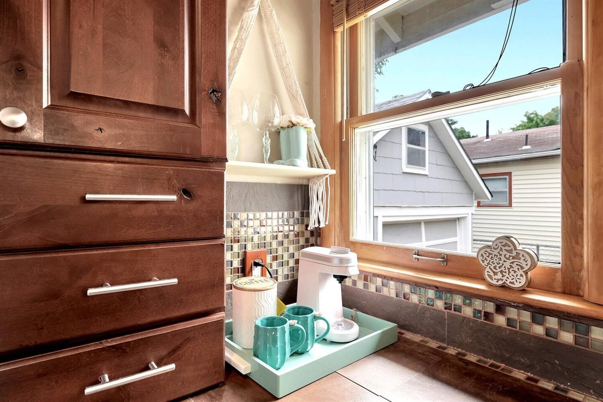 Keirig Coffee Pot along with a drip coffee maker (In cabinets in kitchen)