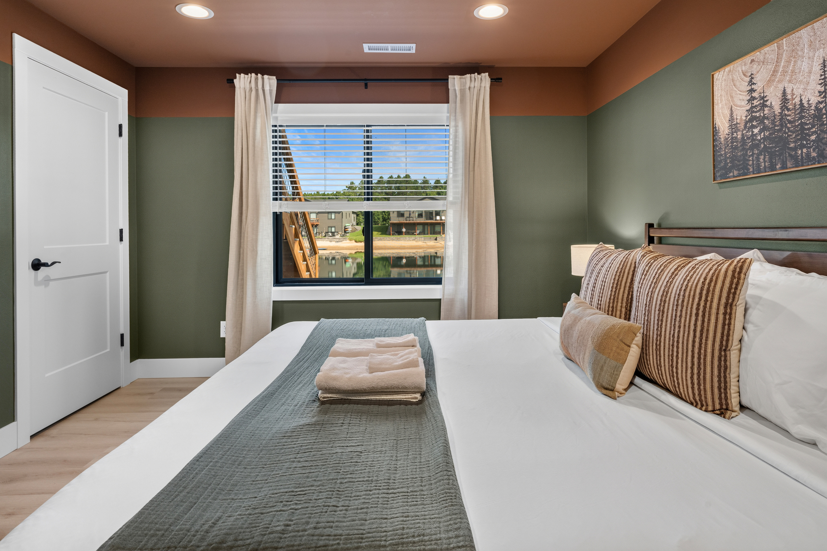 Lounge downstairs king memory foam bedroom with lake view and smart tv