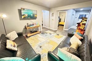 Kick back and relax in our laid-back living room, where comfort and entertainment collide!