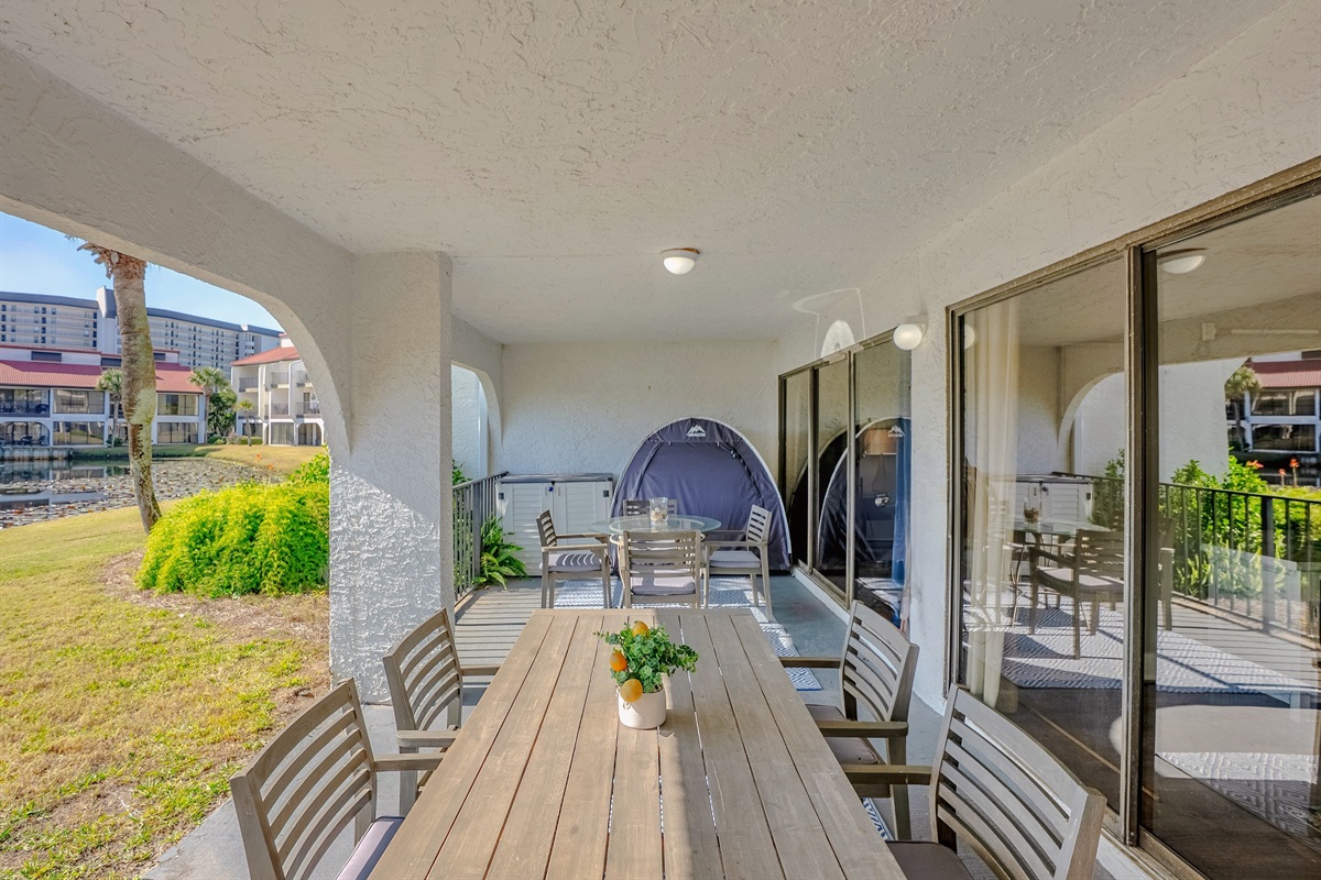 Largest covered patio with two tables for outdoor dining and socializing