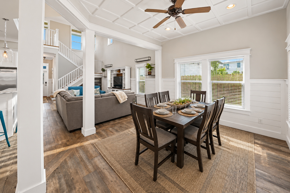 Relax and unwind in this spacious living room, featuring comfortable seating, coastal inspired décor, and plenty of room for the whole family.