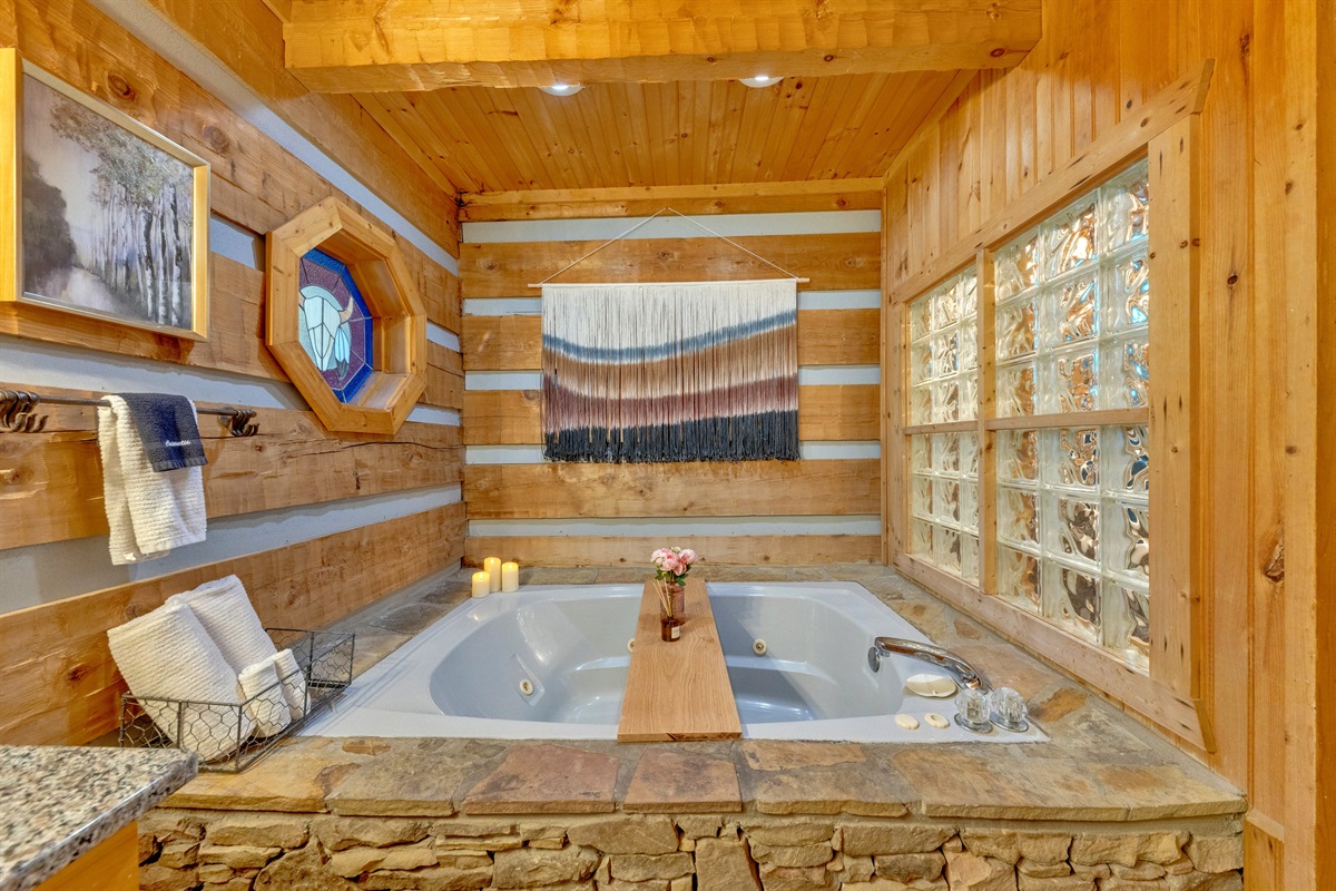Relax and unwind in your private indoor jetted tub surrounded by warm log cabin charm and spa-like touches
