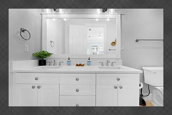 En suite master bathroom with double vanity.