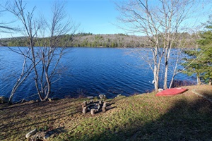 Another lakeview with firepit and log chairs