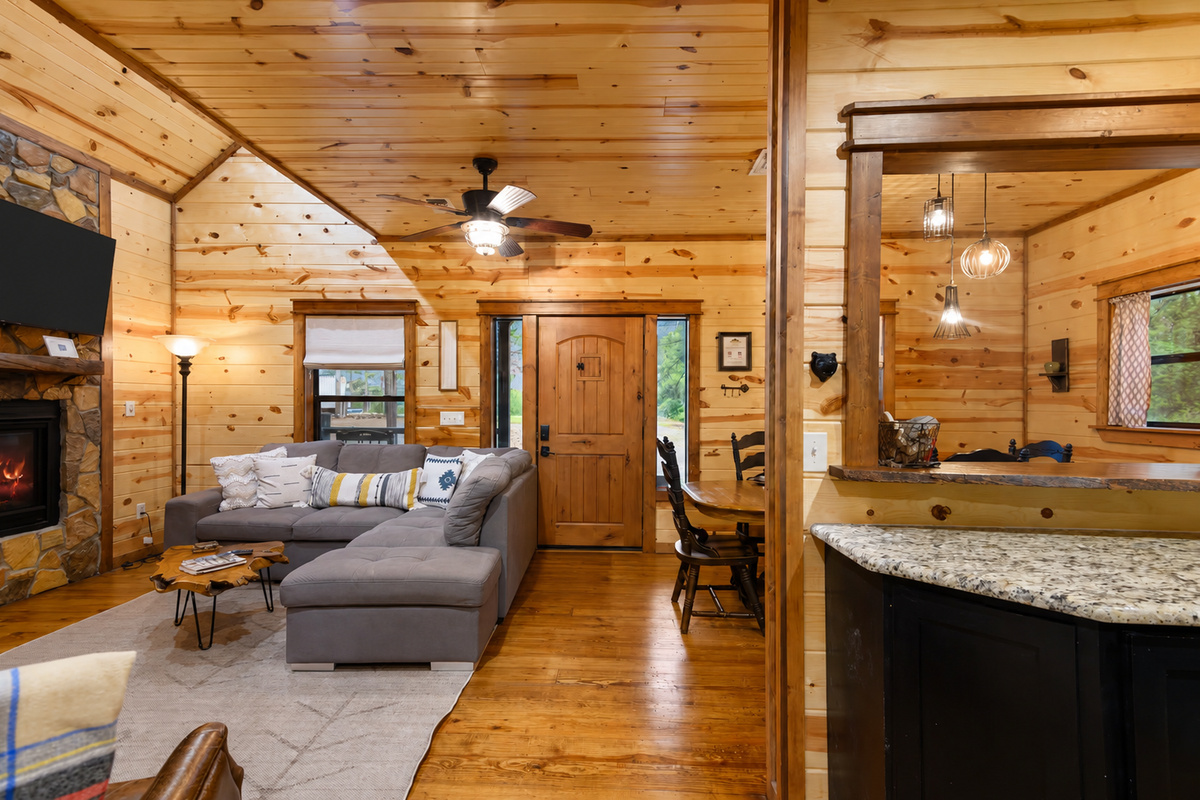 Living Room: Experience serene gatherings by the fireplace in this inviting, spacious retreat!