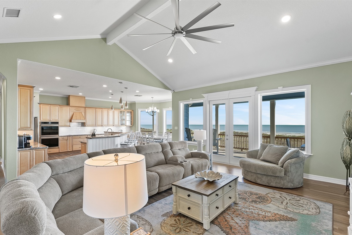 Relax in our spacious living area with plush seating and panoramic views - perfect for morning coffee or evening gatherings.