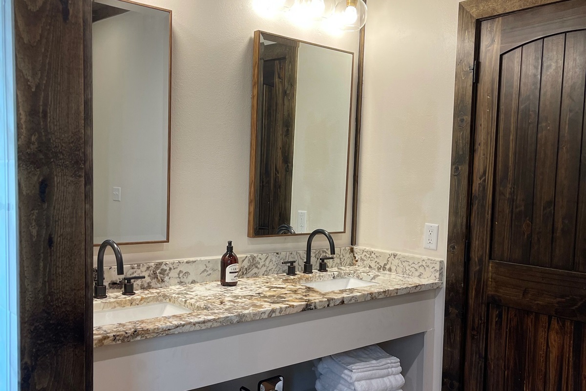 The well-lit double vanity in the master bathroom with plenty of storage space.