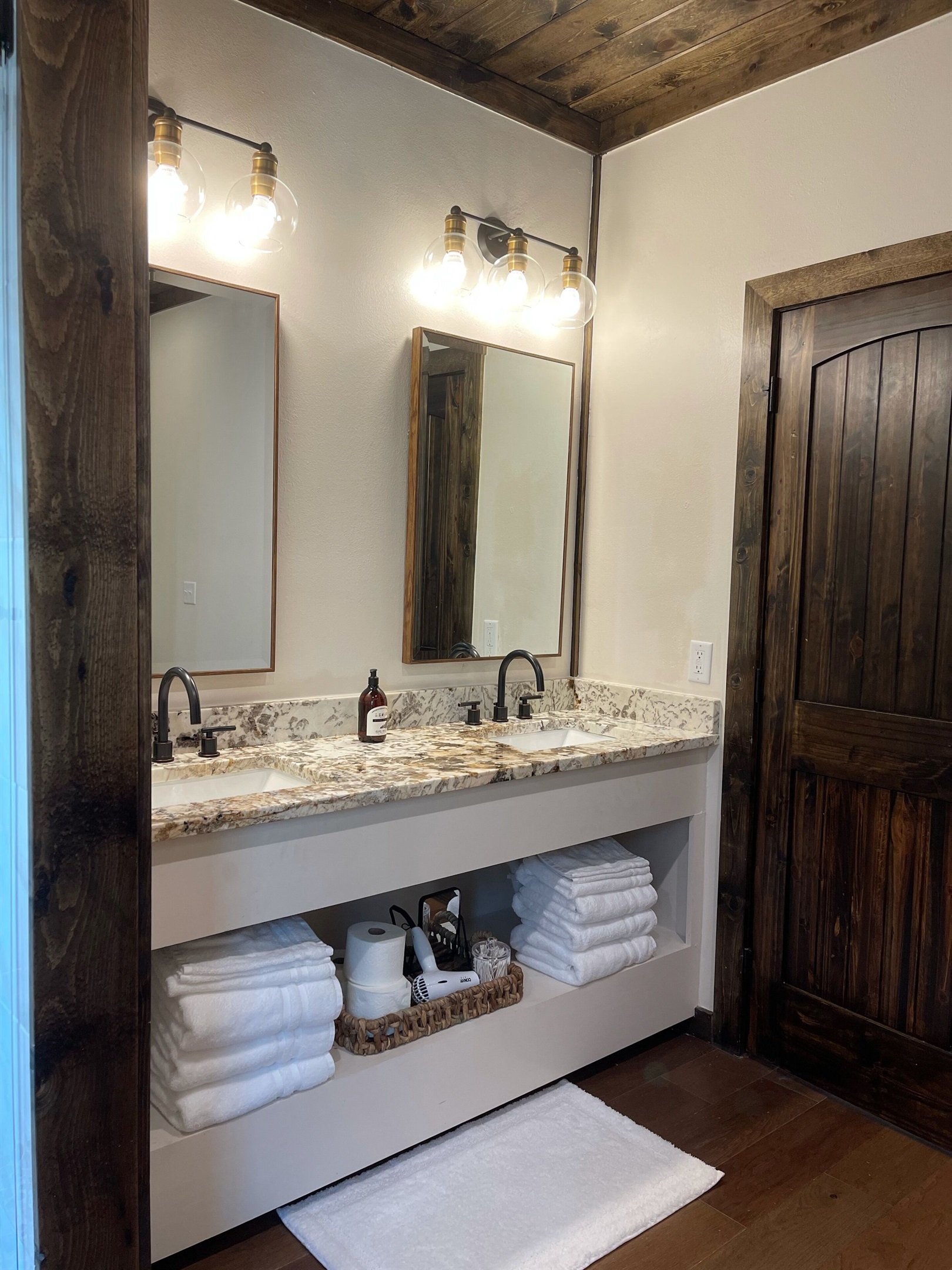 The well-lit double vanity in the master bathroom with plenty of storage space.