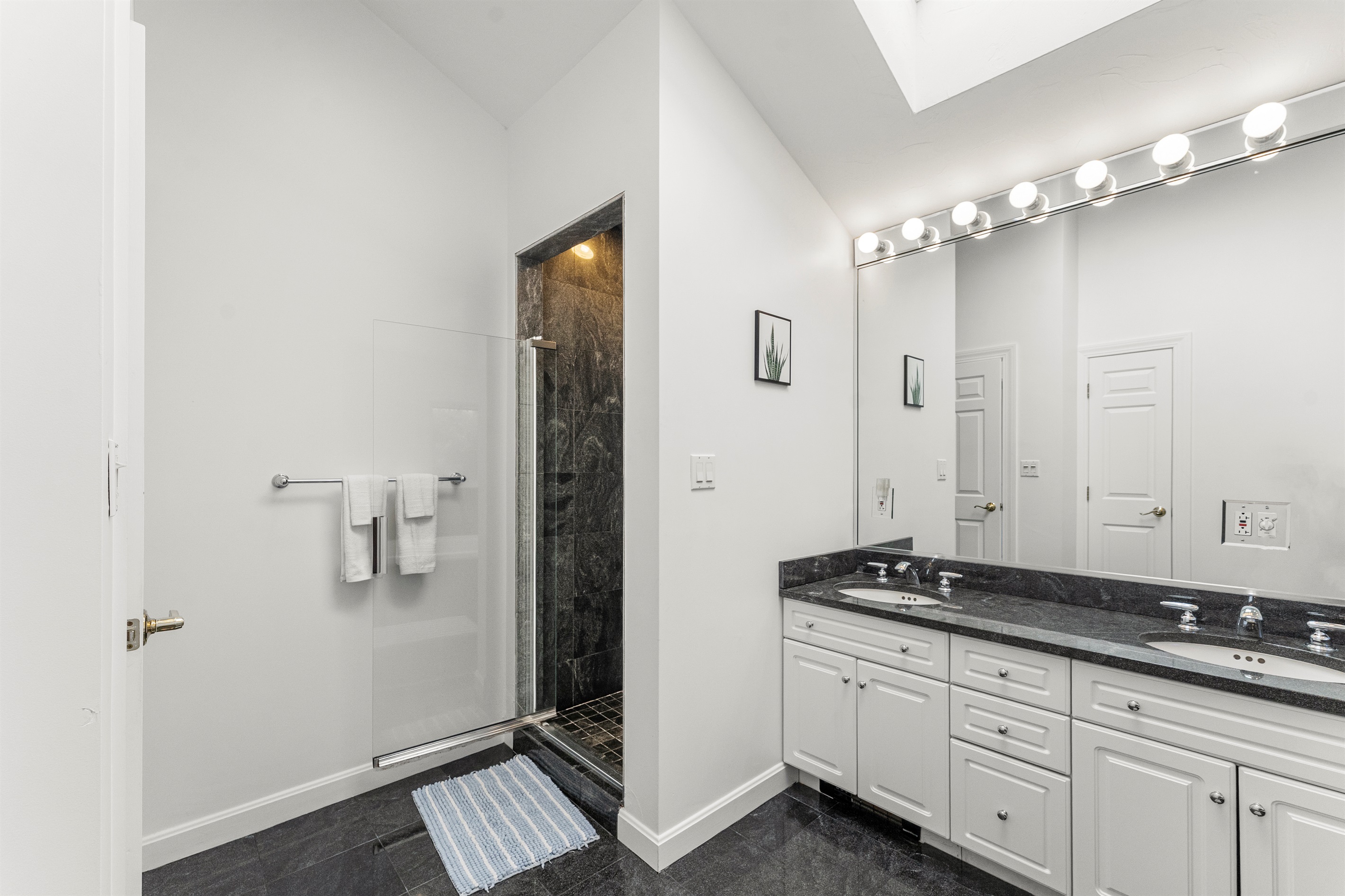 Relax in the queen ensuite featuring a jetted tub and standing shower.