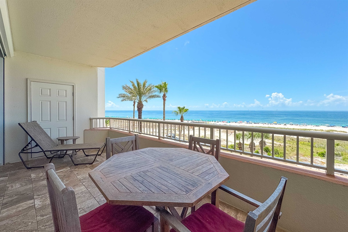 Imagine relaxing in this comfortable chair, with the gentle sound of the ocean breeze drifting in from the adjacent balcony. A perfect retreat.