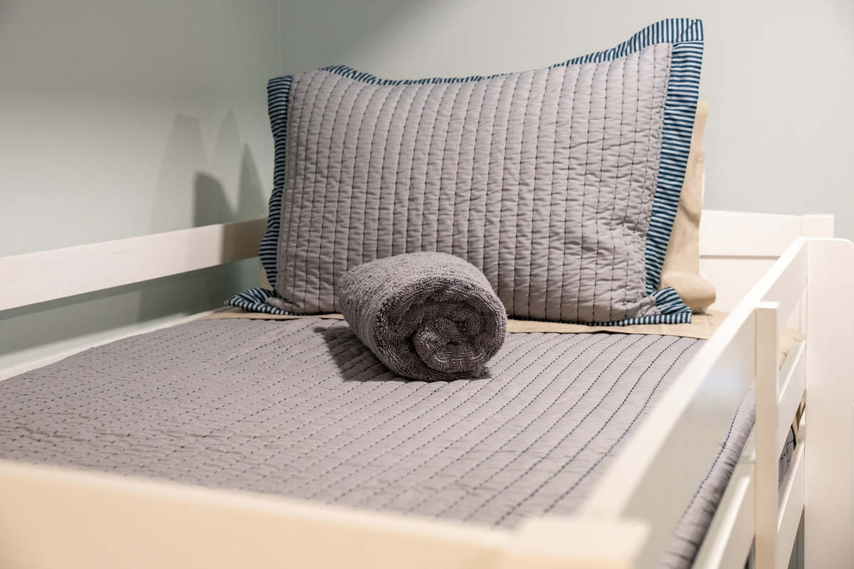 Carefully selected textures, and furnishings give this bedroom a warm, elevated character.