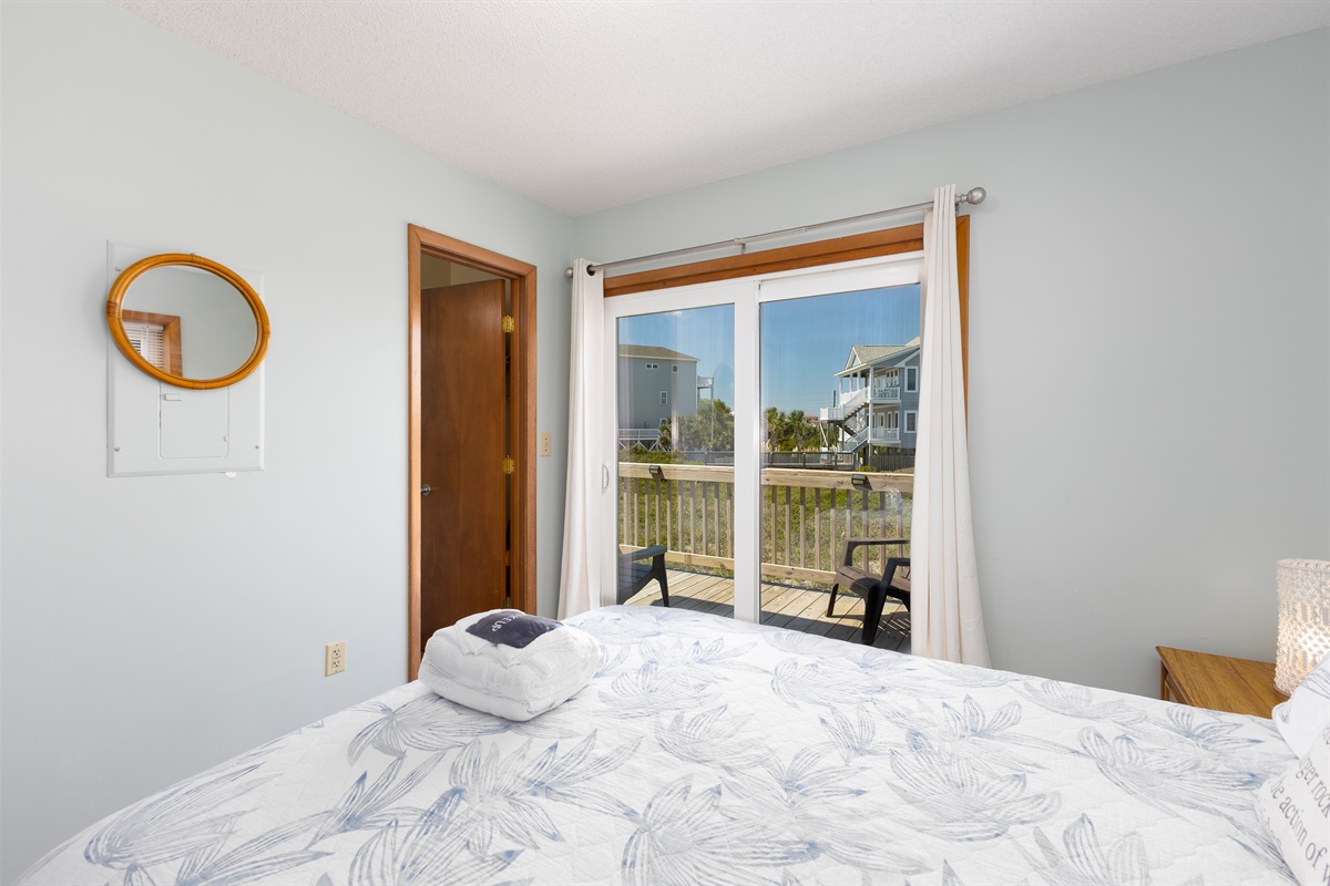 Master bedroom features direct balcony access