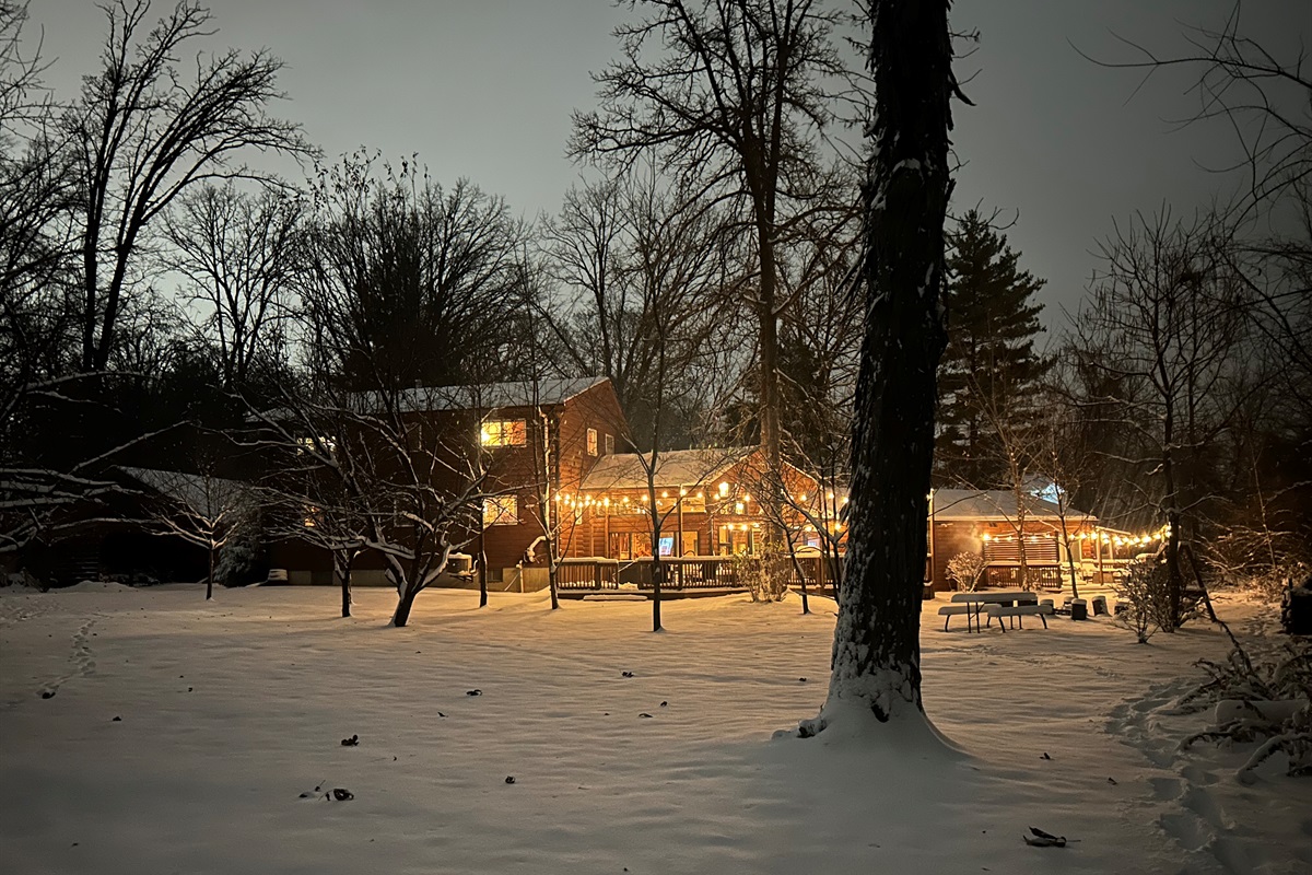 Fresh snow and warm lights make everything look cozy.