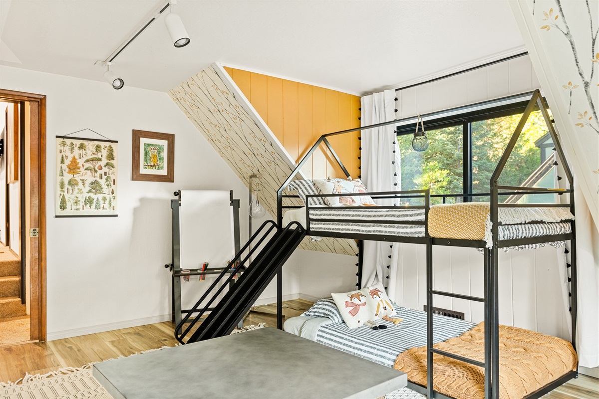 Bedroom 4: Twin bunk beds with a slide is just one element of the fun-filled kids' room!