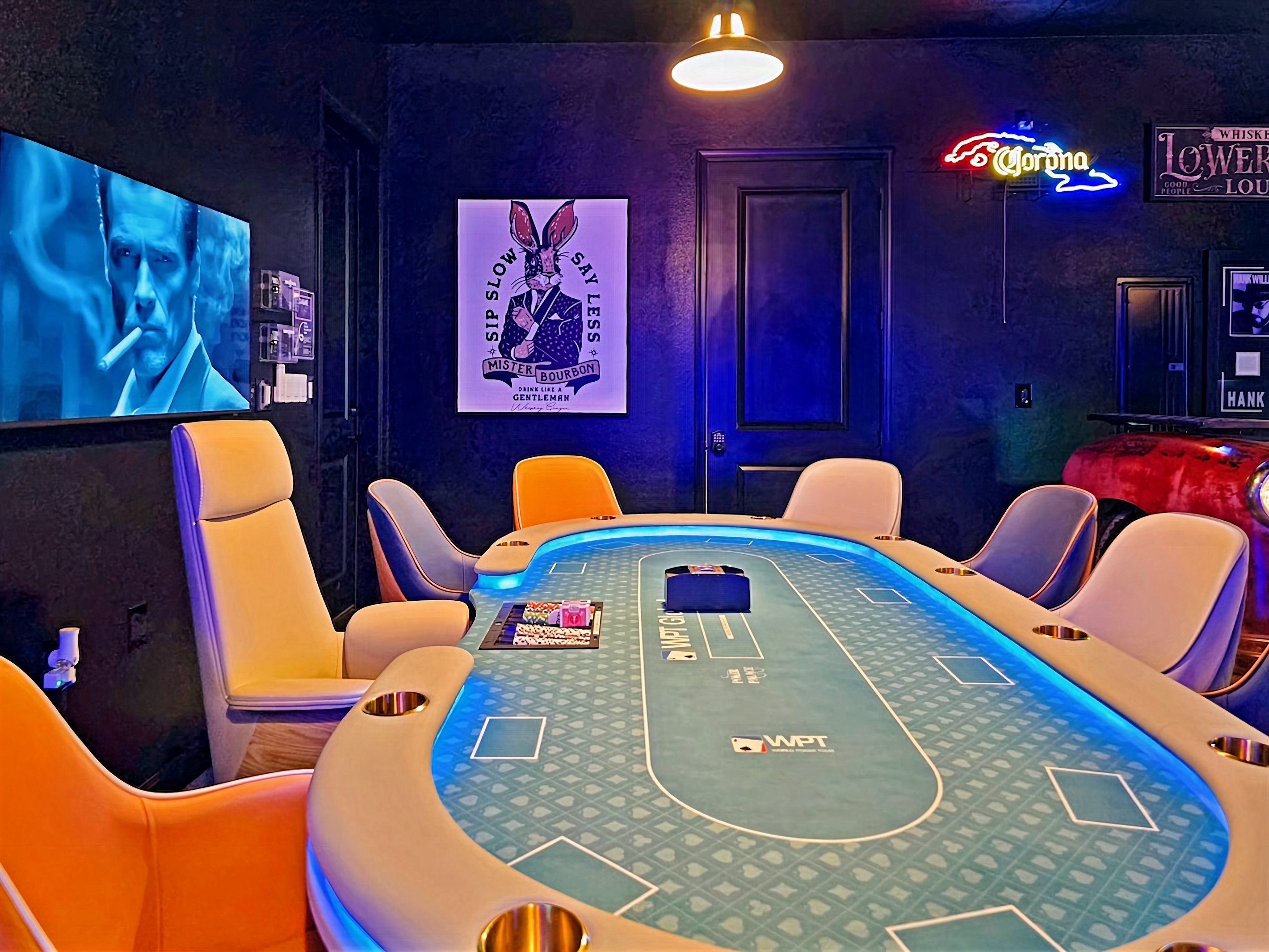 Ultimate game room featuring Vegas style poker table with 10 leather chairs.