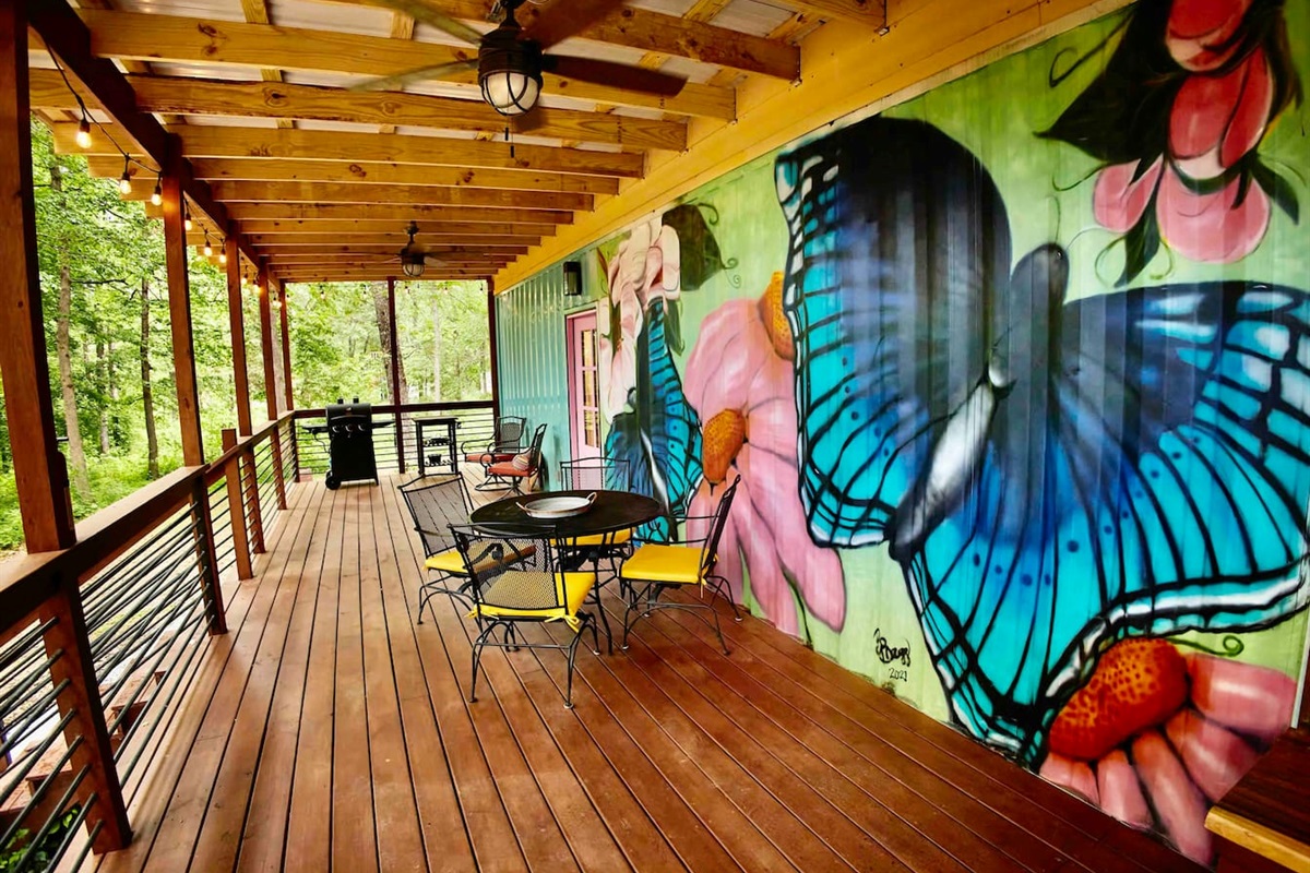 400 square feet of covered deck with outdoor furniture, gas grill, and prep space.  