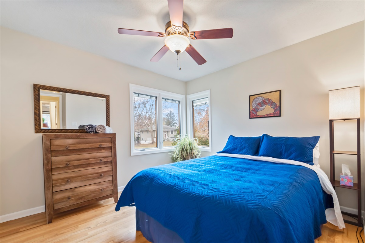 The second bedroom on the main floor has a queen sized bed and window that face south/southwest that let in the beautiful afternoon sun.