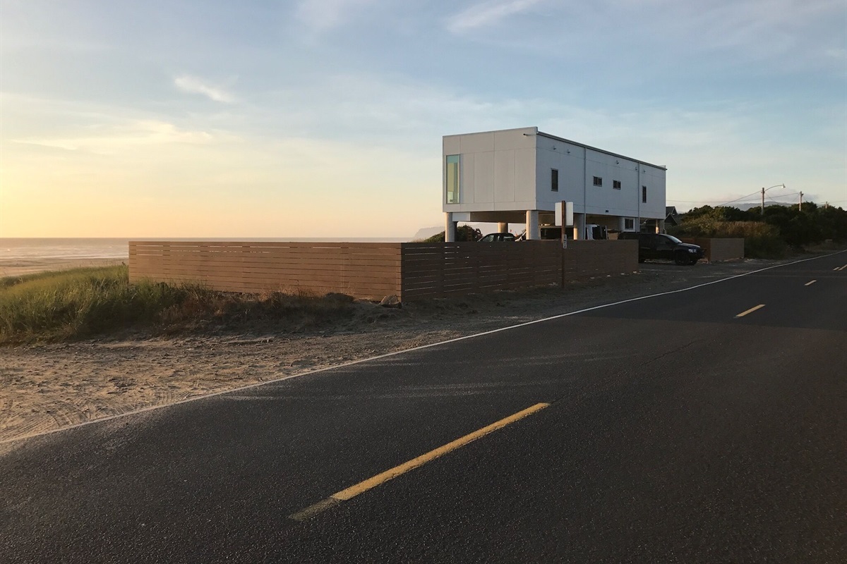 Private yard from the road, but open to the beach!