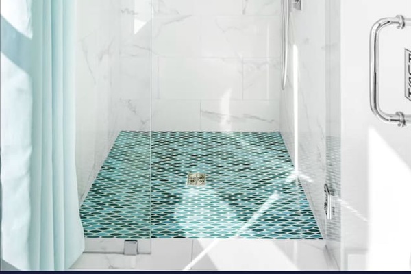 Bright Master Bath with a tall, smart LED shower that changes color with the water temp!  Featuring bespoke coastal cabinets, a unique custom sink, and floods of natural light. A serene, spa-like retreat designed for your ultimate comfort. ✨
