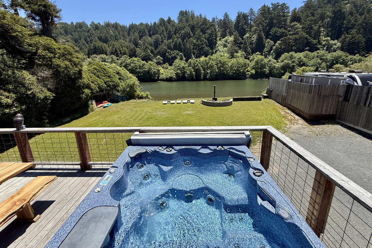 View of the river beach from the hot tub
