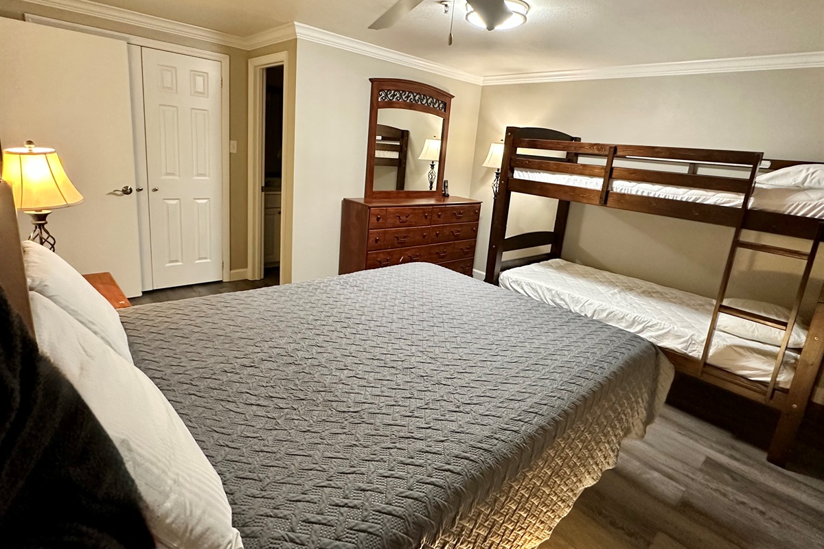 Bunk beds for the kids & a queen bed for the adults in the large second bedroom.