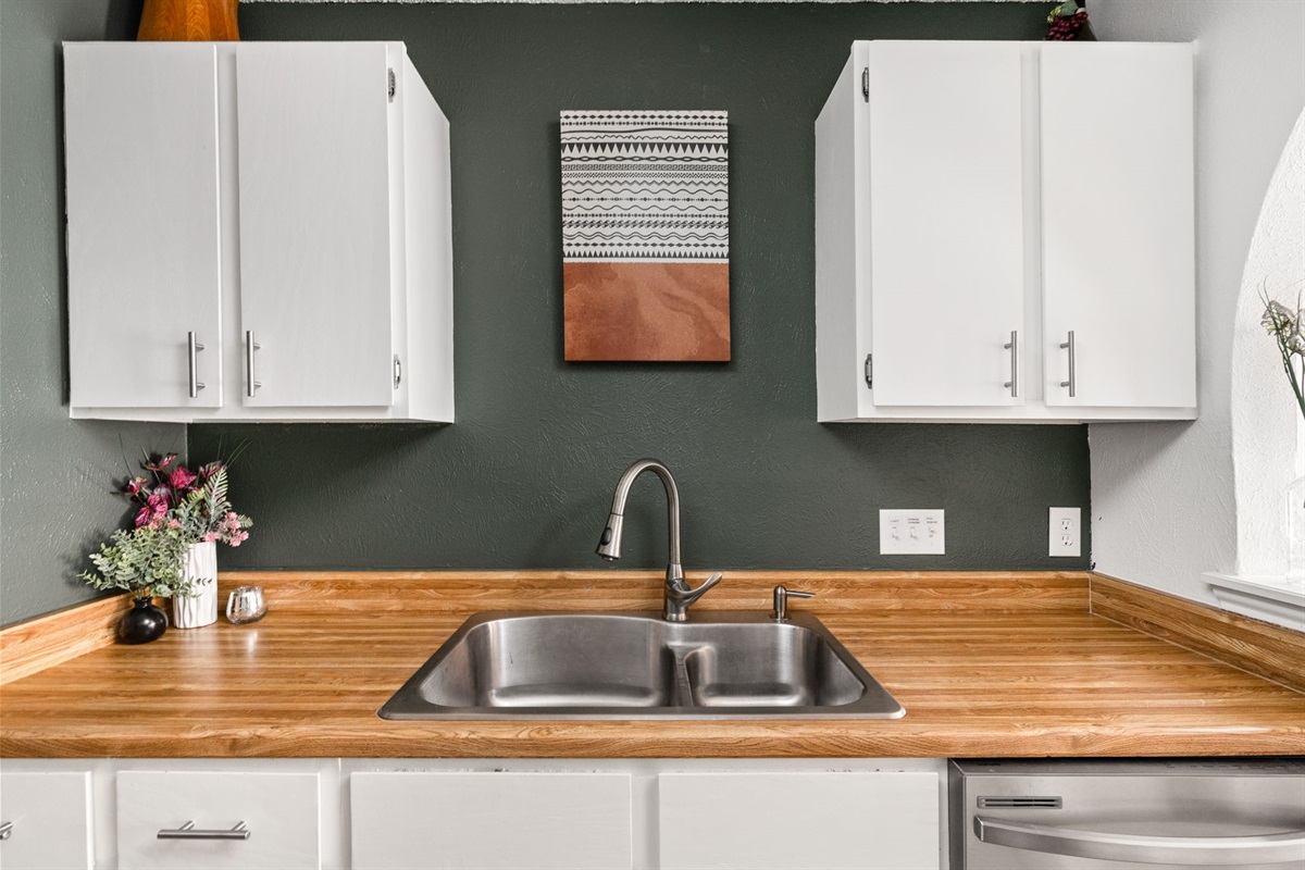 Clean, spacious countertops and a modern sink setup make prep and cleanup feel effortless. It’s a kitchen detail that keeps everything simple, smooth, and enjoyable.
