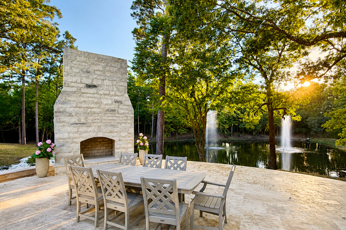 Lower patio with fireplace and Estate Fountain views