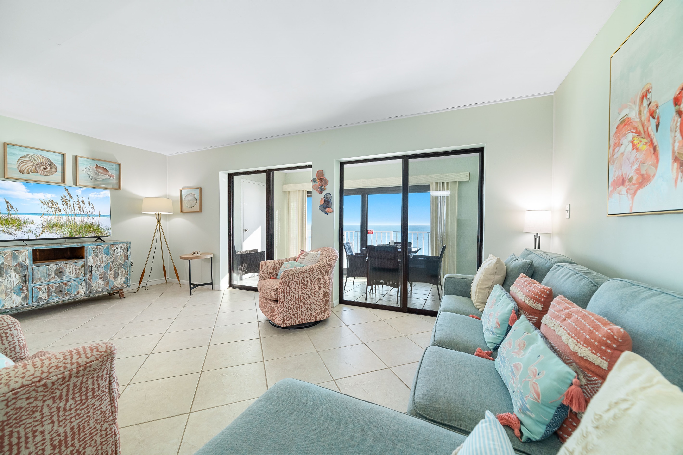 Seamless indoor-outdoor living with expansive glass doors leading to a balcony overlooking the mesmerizing ocean. The perfect blend of comfort and captivating scenery.