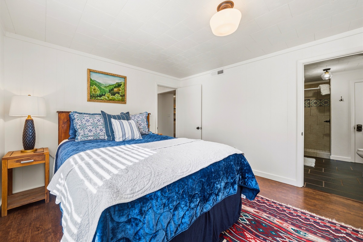 Settle into this bedroom where a clean, simple layout and cozy bedding provide everything needed for a peaceful night’s sleep.