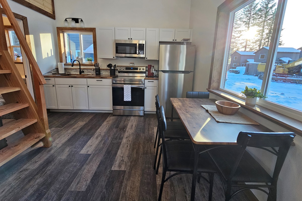 Downstairs (cabin is still being furnished, dining table will seat 4 but may look different.)