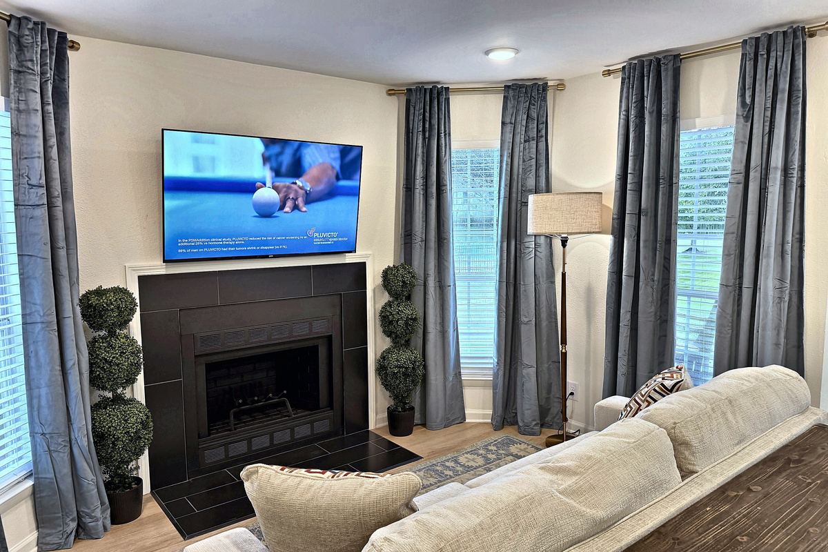 Cozy up by the fireplace with the TV right above it